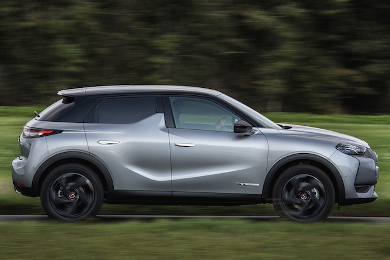 DS3 Crossback E tense exterior side driving in forest